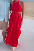 Beautiful dress. The ties in the back make it very adjustable. The back around the waist is elastic. Wore it on vacation in Cabo and got tons of compliments. Usually wear XS and the XS fit perfect. - Missy D.