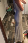 This dress is beautiful! The material is incredible, so soft and well made. I read a lot of reviews that it runs big so I ordered an xs. However, I wanted a flowier fit for our beach reception so I should have actually sized up for it to fit like the picture. I'll just be exchanging ;) That's on me for sizing down. I recently had a baby and so I'm a little bustier than I used to be lol. If you want it to be a loser fit size up if you want skin tight fit it runs true to size! - Chelsea C.