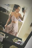 I LOVE the fact that it doesn't zip and it is a wrap. I somehow missed that. The material is very light and airy. It is true to size and I can't wait to wear it out! - Jeanette S.