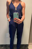 I love this jumpsuit!  I'm pretty small up top so the halter tie was nice to feel secure in this and still flattering in the bust area.  I had to use cutlets instead of a strapless bra since the back does move up and down if you are sitting or squatting down (like to pick up something off the ground).  The material is thin but not see through so it's perfect for warmer nights out. - Meghann G.