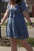 This dress was amazing. I thought the fit was great, since it has the shirred back, a hidden side zipper, elastic sleeve straps, and the front tie. I got so many compliments and felt so confident in the dress. For the bra situation, I just took some cups out of a sports bra and put them in the chest area and that worked great. I literally never leave reviews but this dress is worth it!!!
If you're concerned about modesty: this dress came just at finger tip length with my arms straight down. I definitely wore shorts underneath! It showed some cleavage on me, but nothing that some regular adjustments or fashion tape wouldn't fix if you need. Also, the cut out underneath the front tie really didn't reveal as much as I thought it would, since you can tie it in a way where the ends cover it. - Katie O.