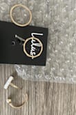 Looked cute in photos, but I just received the item in the mail today and before I could even try the rings on one of them broke in half. Seems to be very cheap material and poorly made. Disappointed. - Briana E.
