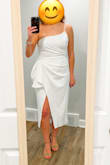 I love this dress and can't wait to wear it for my rehearsal dinner. It was very wrinkled but the fabric steams easily and it looks great now. The slit is incredibly high so be careful how you cross your legs (and spanx are not really an option under this dress unless you pin it). I ordered a medium and found it fit well. - Sarah S.