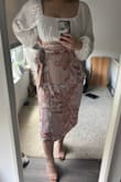 GORGEOUS GORGEOUS skirt. Medium probably wouldve fit fine too. The tie makes it pretty easily adjustable. - Nancy C.