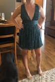This dress is great. I'm 5'4 135lbs, size 27 waist, and ordered a small. It's flattering on my mom-tummy yet sexy with the cleavage. The bust area is a little big and I'm afraid I might fall out so I'm going to get it taken in a bit. The length is great and I don't feel like it's too short. This will be a great dress for Vegas. - Erica F.