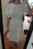 It looks great on the model, but was too tight around the bust, ruining the style of the dress for me- for reference I wear a 30DDD. - Emily V.