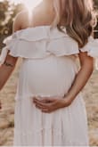 I bought this in a size small hoping it'd work as a maternity dress (pre-pregnancy size XS, 108lbs), and it worked perfectly during my maternity shoot (was 32 weeks at the time)!! Turned out beautiful, obsessed with my photos! - Michelle K.