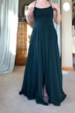 I love the color of the dress, but it was too big and too long. The slit was in a strange place, and I couldn't walk very well in it. - Charis H.