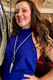Bought this in my favorite color blue and wore it to my niece's wedding this spring. Got soooo many compliments! I'm 5'2" so had it hemmed and wore it with 4-inch heels. Also wore a stick-on bra since it's backless. A Medium may have worked but I have a booty and like a looser fit. Super comfy material that doesn't show sweat. Great for dancing!! Don't hesitate, buy this jumpsuit! - Karen H.