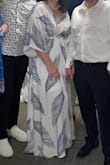 This dress is true to the size. I bought size XL, when I usually wear L, and it was a little too loose, but still beautiful. The underskirt is a little shorter than I would want it to be, so I wore a dress slip on. The dress is light and flowy and even with me being on the heavier side I received A LOT of compliments on how beautiful it made me look. - Natasha G.