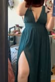 I loved the color of this dress and the fit was somewhat flattering. I found that if I just stood still it would make me look very wide. I sized down due to other reviews and got a small when I am usually a medium, and it was just an inch too tight. I'm not sure if the medium would have been too big but it seemed like it to me. Also, it makes your chest look very nice but you might need to check it all night while wearing this dress. - Sydney V.