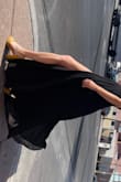 It wore and fit awesome! The adjustable straps were great and I was able to not have to wear a bra since the back is pretty open! The slit isnt too much and can easily be posed open for photos for a little leg action! Overall highly recommend! Seems like the perfect dress for so many body types! - Taylor H.