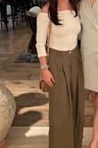 Love this top! It fits perfectly and looks great with jeans, flowy pants, skirts, and more. I have two tidbits to consider - I couldn't wear my strapless bra with it because the under-wiring is thick and it was extremely obvious with the shirt. I also wish the snaps/fabric on the bottom was less thick. - Cari B.