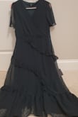 I originally ordered an Xs which ran too small (I couldn't zip up the dress) so I exchanged it for a Small which is now too big. The exchange proceses was very easy though which I appreciated. I'm going to get the dress altered, in both the xs and small the chest area was very big for me my bust size is a 30B which is not even one of the options to choose on the band size. The quality of the fabric is great and so is the color! Everything is as pictured! Very satisfied with my purchase! - Sharon L.