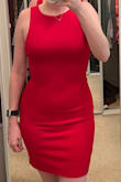 This dress is really comfy and the material is stretchy. I had a little trouble getting the zipper all the way up. Also not super flattering if you have any tummy fat. Definitely going to buy some skims to help make the dress more flattering. - Paige O.