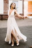 Beautiful dress, but did need to get it altered for length and bust, was way too long and a bit too much fabric for my small bust, but absolutely beautiful dress. Perfect for our engagement shoot. - Briana B.