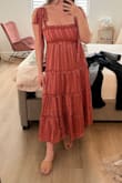 I ordered this for a graduation ceremony and it fits perfectly. I am always worried about the chest being too tight, but it was perfect. The material is kind of silky so it is a nicer style dress. - Mallory P.