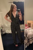 I'm typically not one for jumpsuits but loved how this looked online. The pant legs were rather large, and even at 5'9, I would've had to have them hemmed if I wanted to wear anything less than 3" heels with this.
As someone with a rather small chest, this was too low cut for me. I also would've needed to tan before wearing this! Overall it's very flattering and comfy, but I ended up returning. Was just too long. - Madison N.