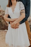 I wore the white dress to my engagement photos. It was super windy which was bad for my hair but great for the dress! Photographs great and not at all see-through on top! - Amanda H.