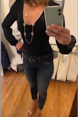 The material is so soft and not too thick so it was great to wear for a spring date night dinner outside, even in the sun. It is very low cut and I have a very small chest so I had to wear a pushup bra underneath to feel comfortable wearing this top. I also have very long arms and these sleeves were perfect! Very feminine and flirty. The bodysuit was comfortable and just needed a mid-rise to high waist jeans/pants to cover all. We went dancing after dinner and all stayed put :) I can't wait for the green to become available in my size! - Meghann G.