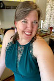 I loved this emerald/dark green dress from the moment I put it on. I'm 38 and will be attending a formal wedding in September in Connecticut. The high neck and full length were perfect. The lace and slit kept it fresh. And I love the way it makes me feel! Perfection all around. - Erin K.