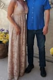 Bought this dress as an alternative for my wedding. It was a second wedding for each of us so I just wanted something pale and neutral. It was perfect. I am 5'4 and wore 4" heels and the dress was still a little long but it was ok. It also plunged a little too much for my comfort so I just put a little stitch in it to bring it a little closer together and it was perfect. - Elena Y.