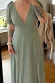I have been looking for a bridesmaids dress in this color for 1,5 years. The color is absolutely perfect. I chose between S and M according to the size chart. The waist is good but the bust is a bit to big, probably due to my shortness. I will have to have it altered in the top and length. Great material, feels exclusive. Shipped to Sweden witch added an extra cost for customs, about $30. - Malin E.