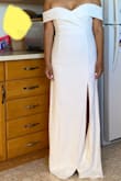 I originally looked on Lulus for engagement party/rehearsal dinner looks for my upcoming wedding. I saw this dress, fell in love, read every single review, and decided to get it for my ceremony and reception.  Mind you, I already had purchased a bohemian dress from BHLDN. I decided to try out this dress, thinking I'd return it if I didn't look great. 
No need. It fit perfectly (it's obviously too long, but that was expected) and I ended up returning my previously purchased dress.  I like how it shows off my small busy modestly. I'm going to add buttons to the back of the dress (from top to bottom) and I'm not sure if I'll hem it yet, but I'm excited for this simple, yet elegant look. 
I went to 6 different bridal boutiques and the fabric on this dress is not the satiny, smooth fabric. It has stretch and looks quite informal up close. It's slightly crepe-y.  That was one negative, but the fabric's sheen (or lack of) doesn't turn up in photos.  This dress actually photographs really well.  I love it. - Grace P.