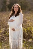 This dress was absolutely perfect for my maternity photos! I usually order a medium from this site but went with a small and it fit perfectly being 33 weeks pregnant! Great quality and would highly recommend it! - Mikayla M.
