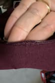 The zipper looks like it has been fixed. Hard time sipping the dress up due to the sewing - Nancy D.