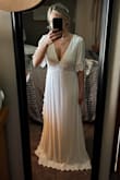This dress is the perfect length for my 5'3" height. It brushes the floor but will not make me trip. The v-cut front is quite low, and very flattering but if you are busty just be prepared. I plan to wear this at my bridal shower so I actually sewed the v-cut about one inch to make it a little more appropriate. It still looks just as flattering. My soon-to-be husband LOVES the dress on me and so do I. I had originally ordered a size small based on other reviews but ended up exchanging it for a medium. The top is a little big but the waist fits nicely so I'm sticking with the medium. Highly recommend. Great fabric, and texture, and it is not see-through. - Katie T.