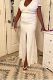 The dress is perfect, fits beautifully and the material is stretchy so you can move in it. I return it because I have back rolls so it's not very flattering. - MICHERLANDE B.