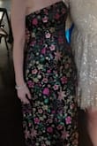 I loved this dress. I wore it to a friend's wedding and got compliments all night long. The bust fit perfectly, but I did have it altered so that the middle section of the dress hung differently. I prefer a tighter look so if that isn't something you prefer I don't think tailoring would be necessary. Its a beautiful dress, highly recommend! - Katherine G.