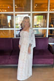 I found this dress a week before my wedding and it was perfect. The fit was almost exact. It did need to be hemmed and if I had more time I would have taken it in a little bit around the waistline to fit more like the model, however, it fit well enough that I could get away with wearing it as it was. Definitely a lucky find. - Antonia S.