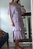 I love this dress. It's so fun and flirty, and the lavender is such a beautiful spring color. The tiers have a bit of flare to them, and it adds a little extra! It's SO comfortable and the elastic allows some stretch in material. I'm usually in between small and medium, but the small fit perfectly. Can't wait to dress this up for a wedding. - Gabriella B.