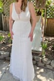 This is the wedding dress I was looking for! Elegant, shapely, affordable. Has a beautiful design with beads and sequins. It's moveable for dancing and just the right length with some heels. I love the back. I thought the front would be too low for my taste but I ended up embracing the curves! Very happy with this purchase. - Vanessa O.