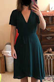 I mostly liked the outside material and the color, but the fit was very unflattering. I felt matronly in it. The top part was too big and boxy. The dress itself was heavier and had more material than anticipated. The arms really aren't exposed - the material stays covering your upper arms. The hem line length was inconsistent. The bust line dips low - it would be hard to wear a normal bra with it. No matter how tight you tie it, you can't make it fit better. I really wanted to like this dress, but it was just off in too many unflattering ways. - Caitlin H.