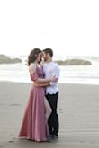 I wore this for our engagement photos on the beach. This dress had amazing flow and the *swoosh* factor was unreal. I was surprised at how long it was- I am about 5'11 and wore inch heels and still had to hold up the hem to keep from stepping on it. 
I think I could have worn a small as far as height was concerned, but the upper half of the dress fit well- with the exception of the little metal snap that's supposed to keep you from flashing anyone. It was way too high and it came open any time I moved my arms or moved at all. I ended up taking it off with a seam ripper and using a safety pin because I ran out of time to sew it on lower. I had to be careful I wouldn't flash anyone my bra line (I wore a sticky bra- would probably get just stickers next time). 
That being said, it looked amazing and had a very magical feel to it- I'd have to hem it and re-sew the snaps to make it feel truly comfortable to wear. - Monica L.