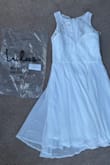 I ordered this dress for my graduation ceremony, I was very excited to wear this dress, but upon the dresses arrival, I opened the package and was immediately greeted with a dress from a completely different website with a completely different style. This dress looks like a tablecloth and has lace that was not advertised as the picture. I spent 60 dollars on this dress and unless I get a refund and an exchange for the right dress I will not be ordering from this site again. If I could give zero stars I would. - Jordyn G.