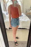 Such a cute top I went back and ordered it in white! I'm usually between a S and XS but went with a XS because I didn't want it to be too boxy and it's perfect! Super comfortable and the knitting is tight enough where it's not extremely see-through. - Caroline B.