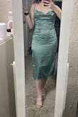 This dress was definitely not made for those of us with small busts! The fabric won't stay in or out. Just looks weird! I thought it would have a more square neckline but nope. - Ana K.