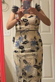 I waited one long year to get this dress, it is so beautiful and the details make it looks very elegant and unique. It is a little loose in the waist, but I'll keep it. I love this dress and I highly recommend it. - Karla G.