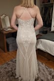 My daughter is getting married in Vegas and wanted a 20' style art deco feel to the dress. I found this online and was a little sceptical but I can honestly say it's every bit as gorgeous as the photos suggest. It's very well made and the quality is amazing for the price. It's not too heavy and it flows beautifully. She is absolutely thrilled with this dress - Yvonne H.