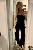 I love this jumpsuit! Wanted something different for my birthday dinner and this was perfect. its a really nice material with a bit of stretch too. I'm 5'6 and I think an inch taller and I'd have issues with the torso length but this just fit without any issues. Great price too and can definitely be dressed up or down. - Lauren V.