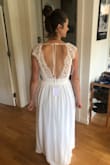 I was looking for a chill wedding dress for a DIY wedding this summer and this one fit the bill perfectly (and I tried on a lot of dresses)!  I will need to get it hemmed since I'm pretty short and am not planning on wearing heels.  I have pretty broad shoulders, but this dress fit perfectly.  It has enough support that I don't need to worry about a bra, which is super nice and the back of it looks really pretty.  The slit makes it easy to dance in and overall it's pretty comfortable. - Marie N.