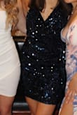 I bought this dress for a fraternity formal I was invited to and it was amazing! I felt so confident in the dress and it was really comfortable! I was worried the sequins would be irritating because I have sensitive skin but that was not an issue. The dress was a bit large in the chest but once I tightened the straps it was perfect! I've worn a lot of cocktail dresses this past semester for various events and this has been my favorite dress by far. The picture on the model makes it appear darker than it really is, but it is still a beautiful, dark navy color (just not as close to black as the model picture.) - Hannah S.