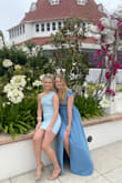 This dress is perfect! I wore it to a wedding and got so many compliments. There are plastic grips built into the shoulders to prevent the shoulders from falling down. The fabric is thick enough to wear without a bra. The dress is lined nicely with a satin-appearing material. The slit is cut at an appropriate length and location. It is comfortable, flattering, and well made. - Annabelle P.
