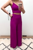 I love the colour. The pants fit great (tight) though. I wish the slits were more apparent (I don't think they'll show much leg). The top feels very slightly off (feels loose in front, but looks like it's tight and pulling at the back) Perhaps because I'm very small chested. I still recommend it. - Salimah J.
