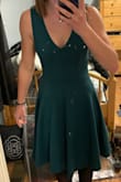 It fit super well and is a flattering dress. The material is thick and sturdy. The dress can be dressed up or dressed down but it's a good staple for the closet to wear to weddings and other events. - Sophie B.