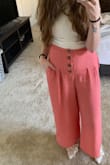 I've worn these pants to work once so far, and got so many compliments on them. They are soft and comfortable, and the waistband stretches a little bit. They're longer on me than on the model because I'm tiny, but I think they still look great. Perfect for spring and summer! - Cait D.